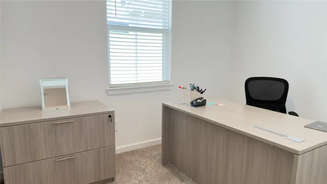 a bathroom with a sink and a window