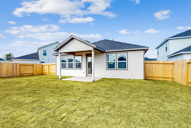 a house with swimming pool in front of it