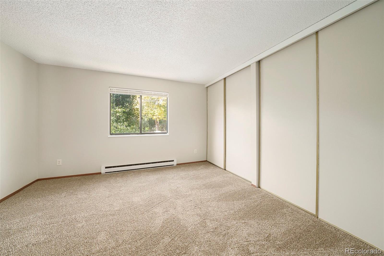 925 Columbia Road, Unit 726 Fort Collins, CO 80525 - Photo 8 of 14 an empty room with windows