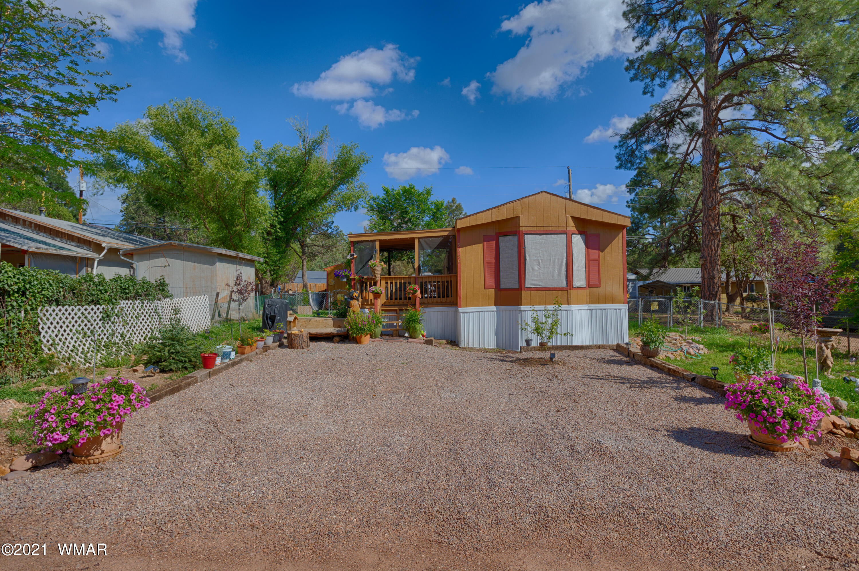 a front view of a house with a yard and a garage