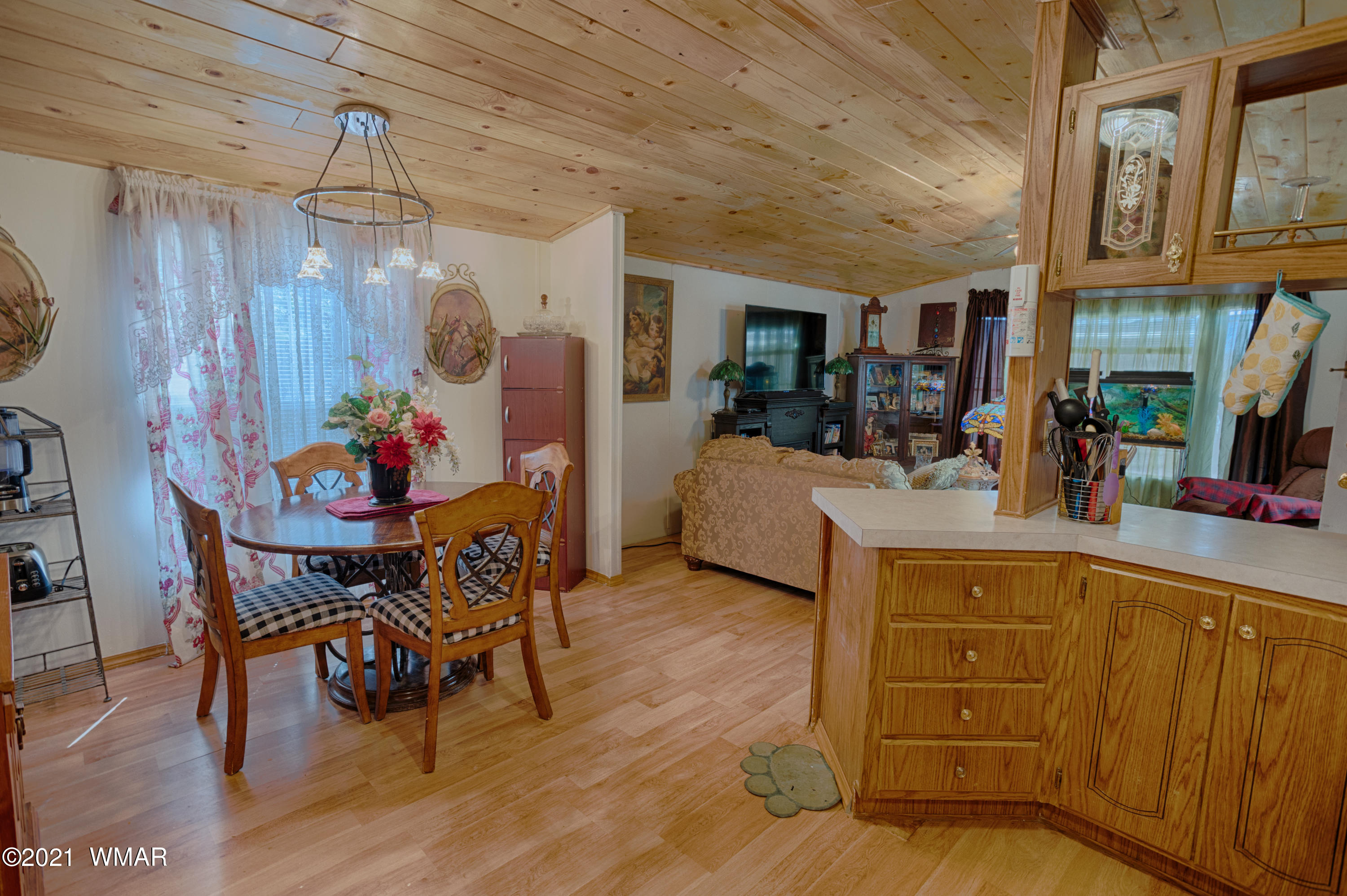 3359 Rim Lakes Drive Overgaard, AZ 85933 - Photo 7 of 17 a view of a dining room with furniture and wooden floor
