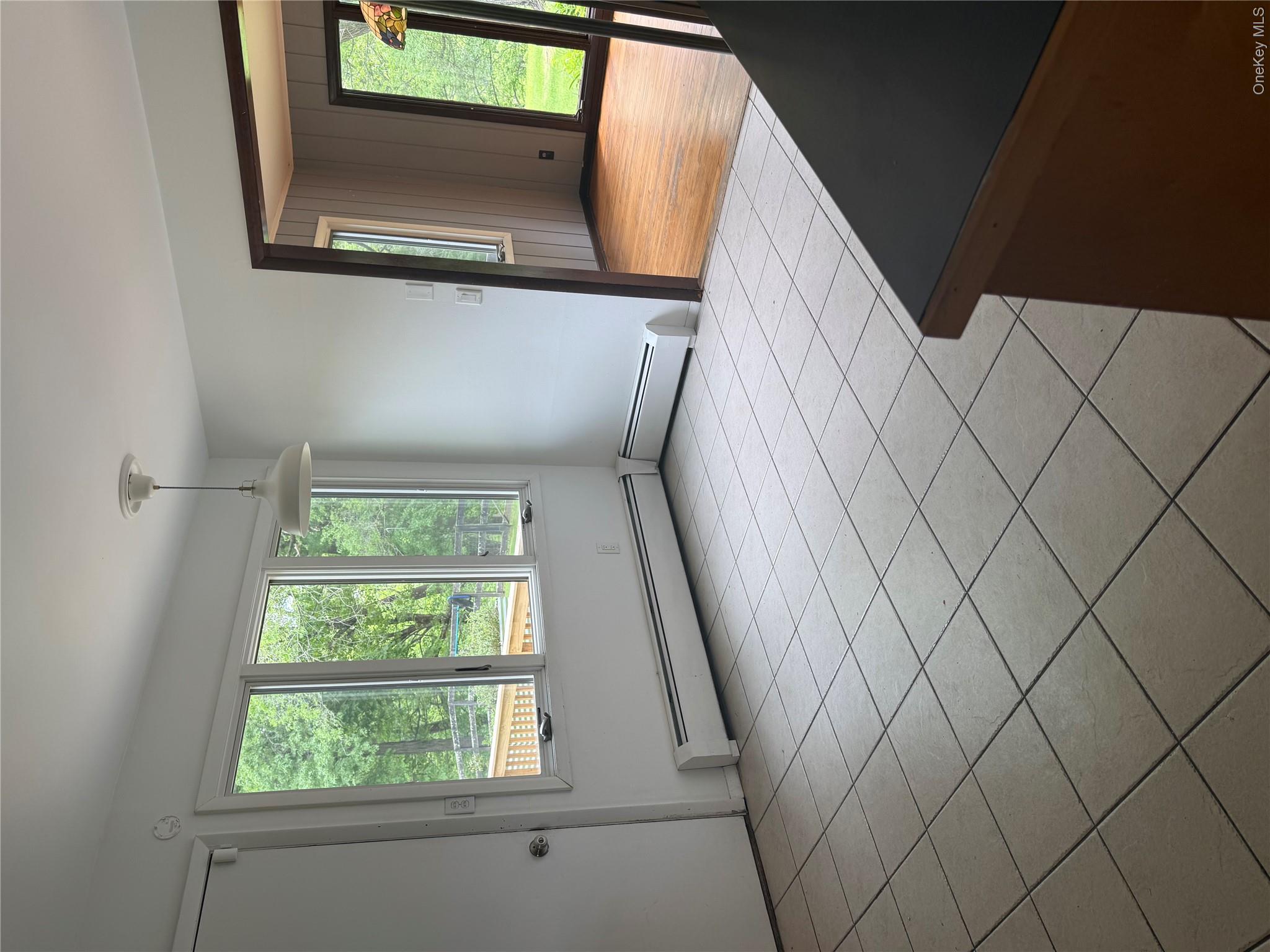 183 Barrytown Road Barrytown, NY 12507 - Photo 15 of 41 a view of an empty room with wooden floor and a window