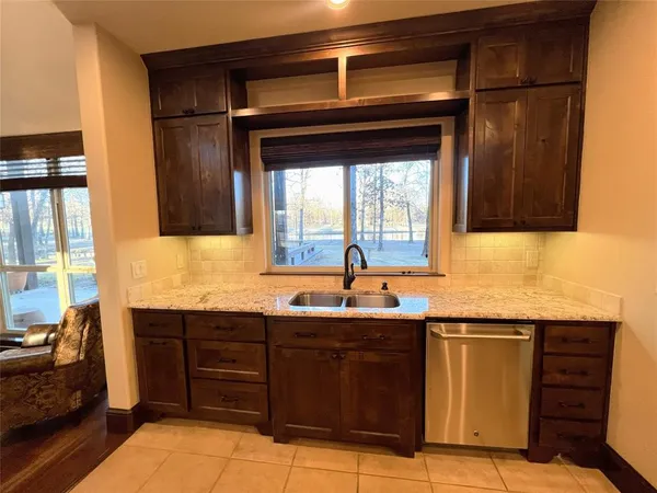 a kitchen with a sink and cabinets