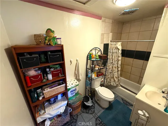 a bathroom with a toilet and shower