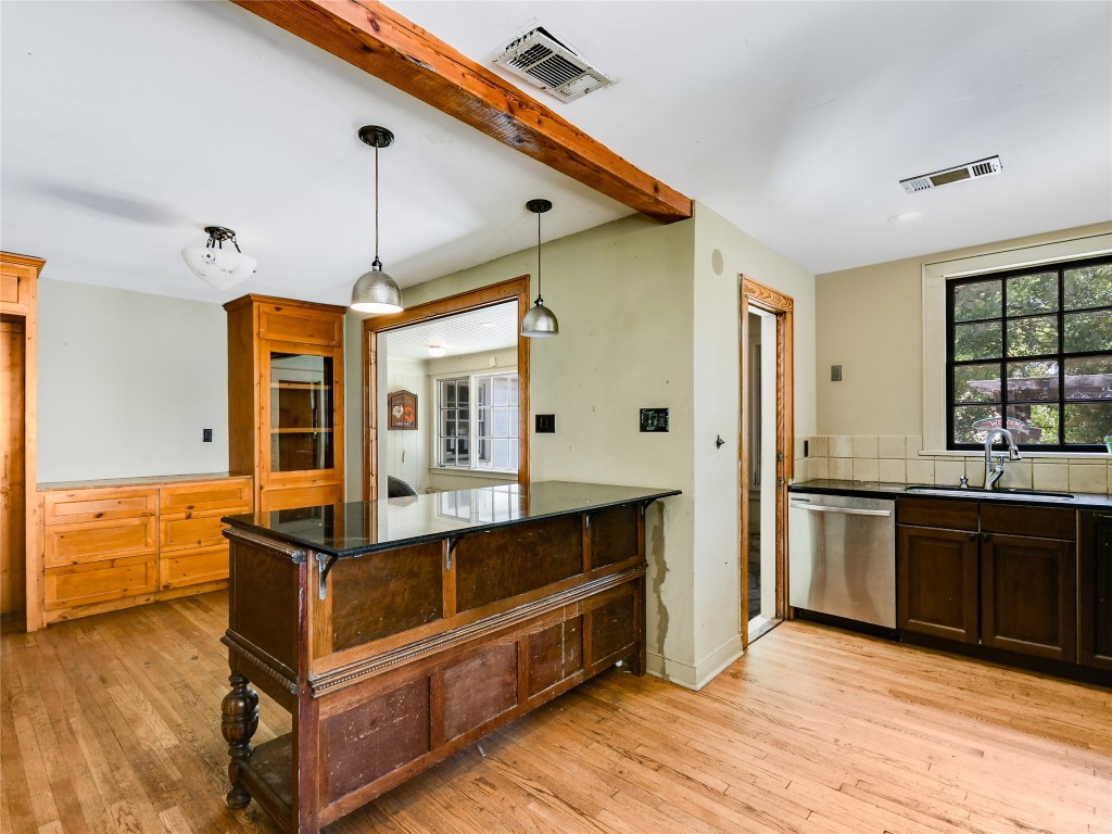 2304 Longview Street Austin, TX 78705 - Photo 13 of 31 a large kitchen with stainless steel appliances granite countertop a stove and a sink