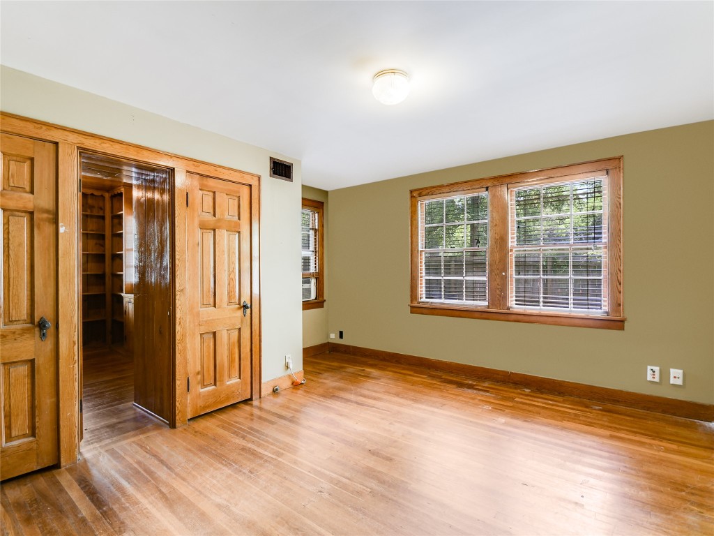 2304 Longview Street Austin, TX 78705 - Photo 14 of 31 Bedroom 1 downstairs - door to hall and study