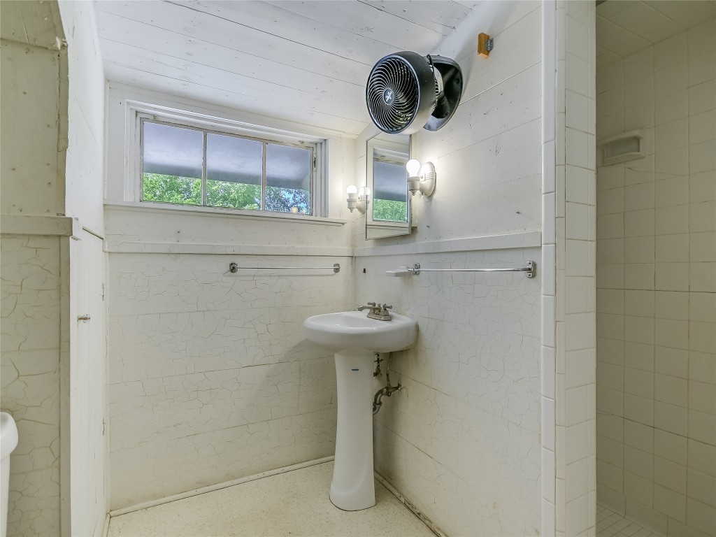 2304 Longview Street Austin, TX 78705 - Photo 22 of 31 a bathroom with a sink and a mirror