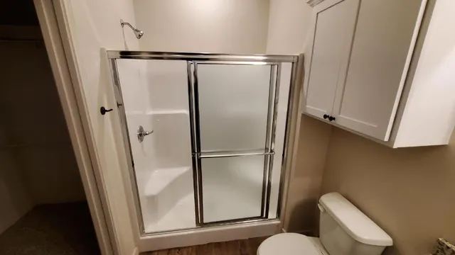 a bathroom with a glass shower door