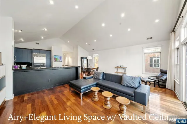 a living room with fireplace furniture and a flat screen tv