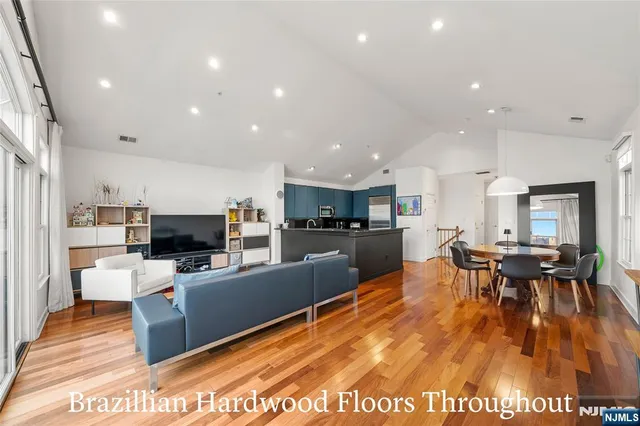 a kitchen with granite countertop a stove top oven a sink and cabinets