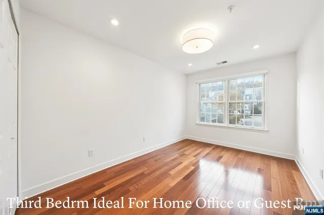 a spacious bathroom with a shower sink and mirror
