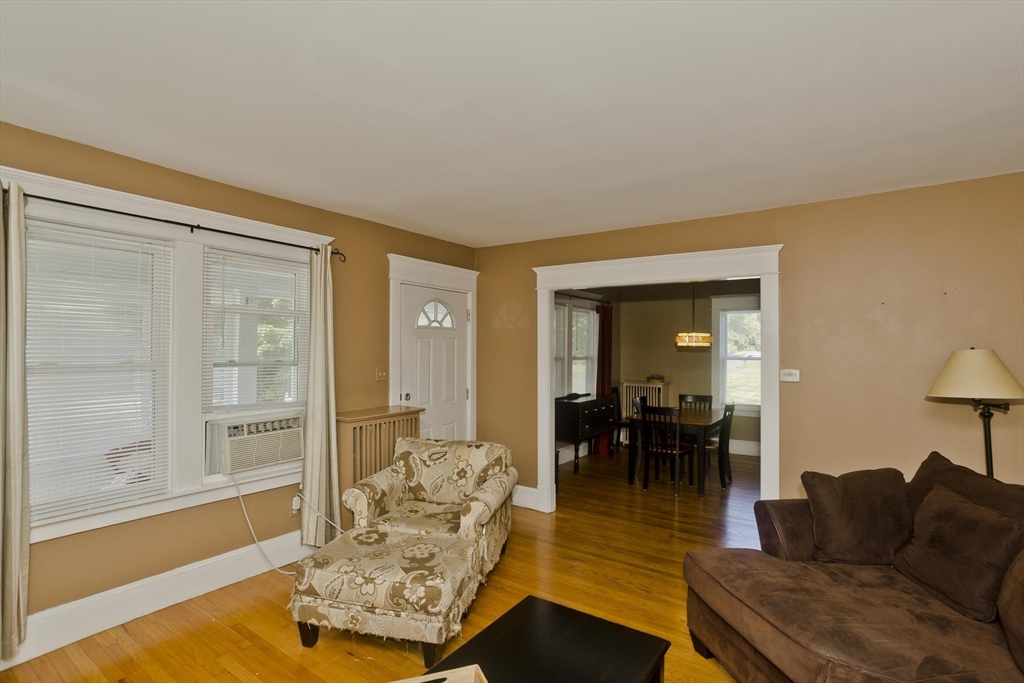 103 Hillcrest Avenue West Springfield, MA 01089 - Photo 11 of 28 a living room with furniture and a large window