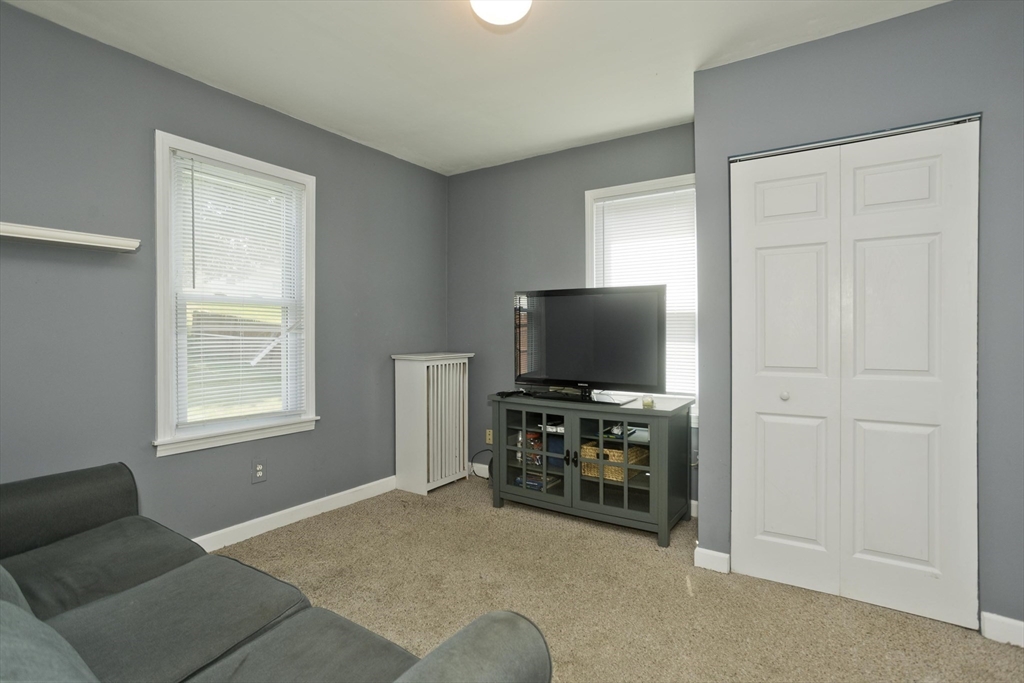 103 Hillcrest Avenue West Springfield, MA 01089 - Photo 12 of 28 a livingroom with furniture and a flat screen tv