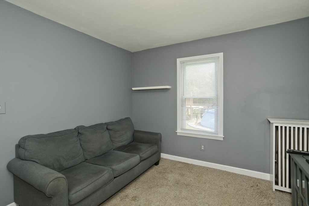 103 Hillcrest Avenue West Springfield, MA 01089 - Photo 13 of 28 a living room with furniture and a window