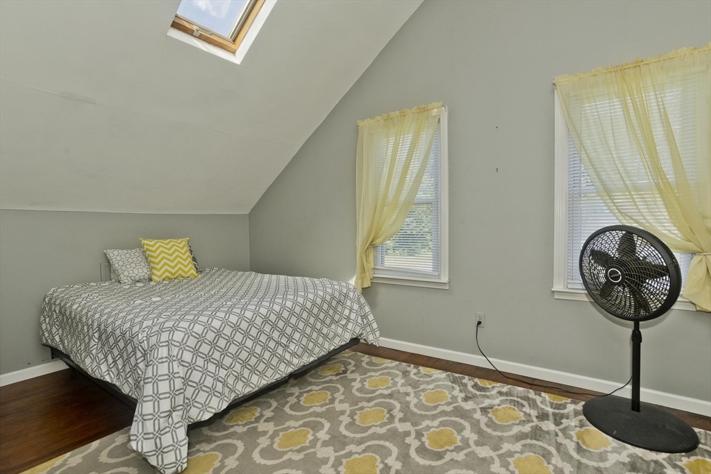 103 Hillcrest Avenue West Springfield, MA 01089 - Photo 17 of 28 a bedroom with a bed and a chandelier