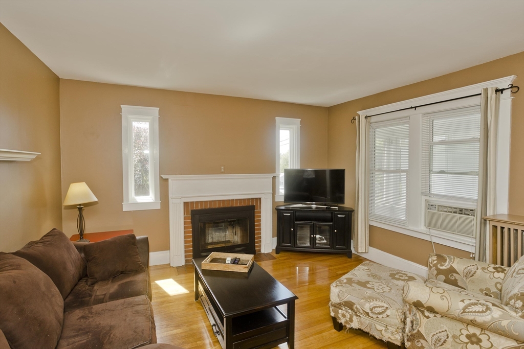 103 Hillcrest Avenue West Springfield, MA 01089 - Photo 10 of 28 a bedroom with furniture and a fireplace