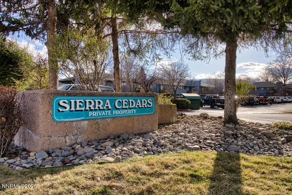 a sign broad in front of a road