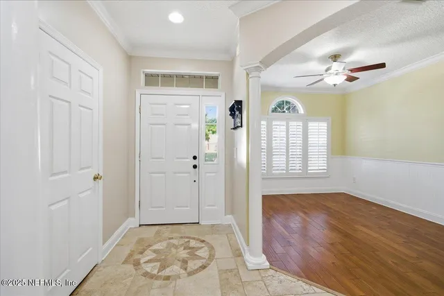 a kitchen with granite countertop cabinets stainless steel appliances a sink and a window