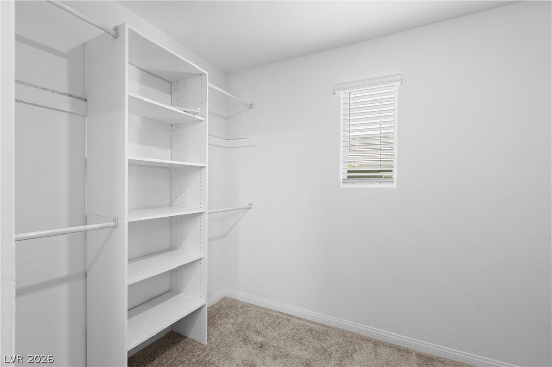 12367 Indigo Montage Road, Unit 3 Las Vegas, NV 89183 - Photo 14 of 33 This spacious closet features ample shelving and hanging space for optimal organization.