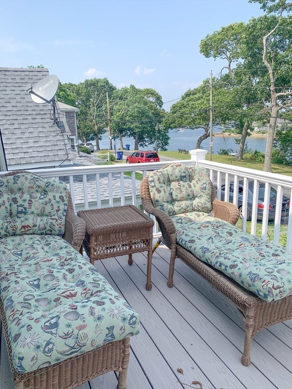 8 East Boulevard Wareham, MA 02558 - Photo 20 of 39 a view of roof deck with chairs and wooden fence