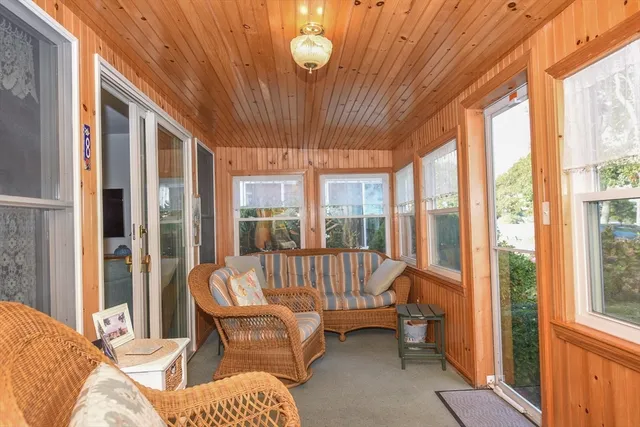 a view of a chair and table in the balcony