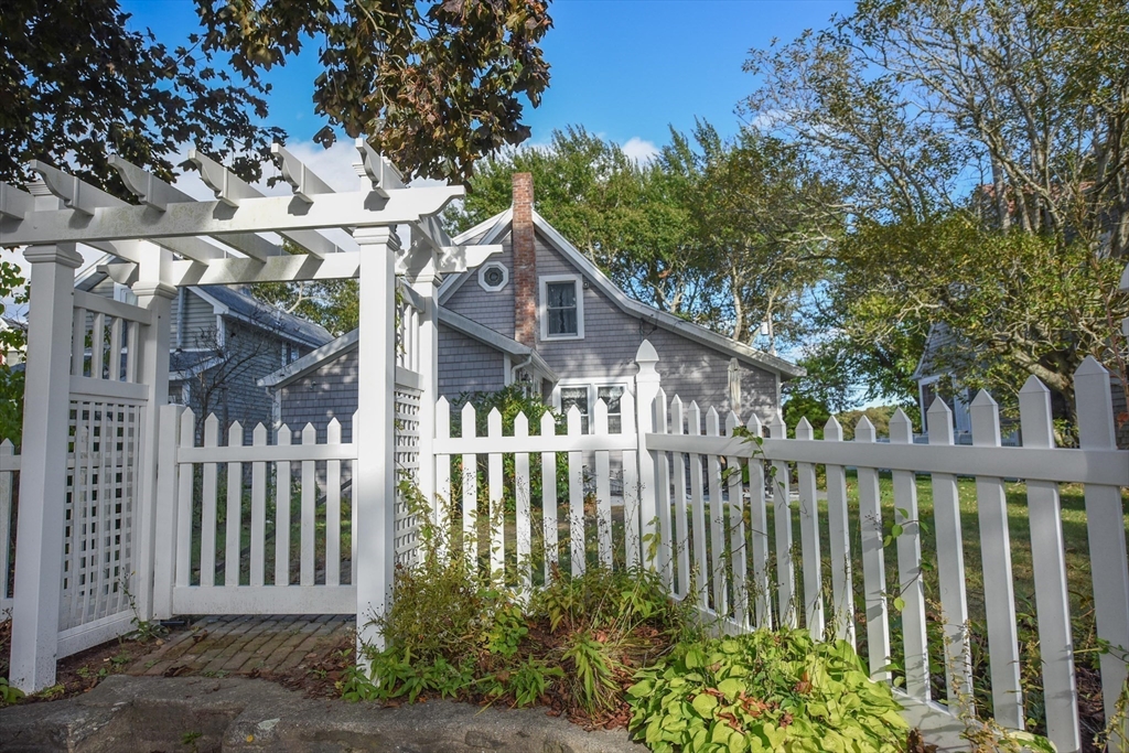 8 East Boulevard Wareham, MA 02558 - Photo 27 of 39 a view of a house with a small yard and wooden fence