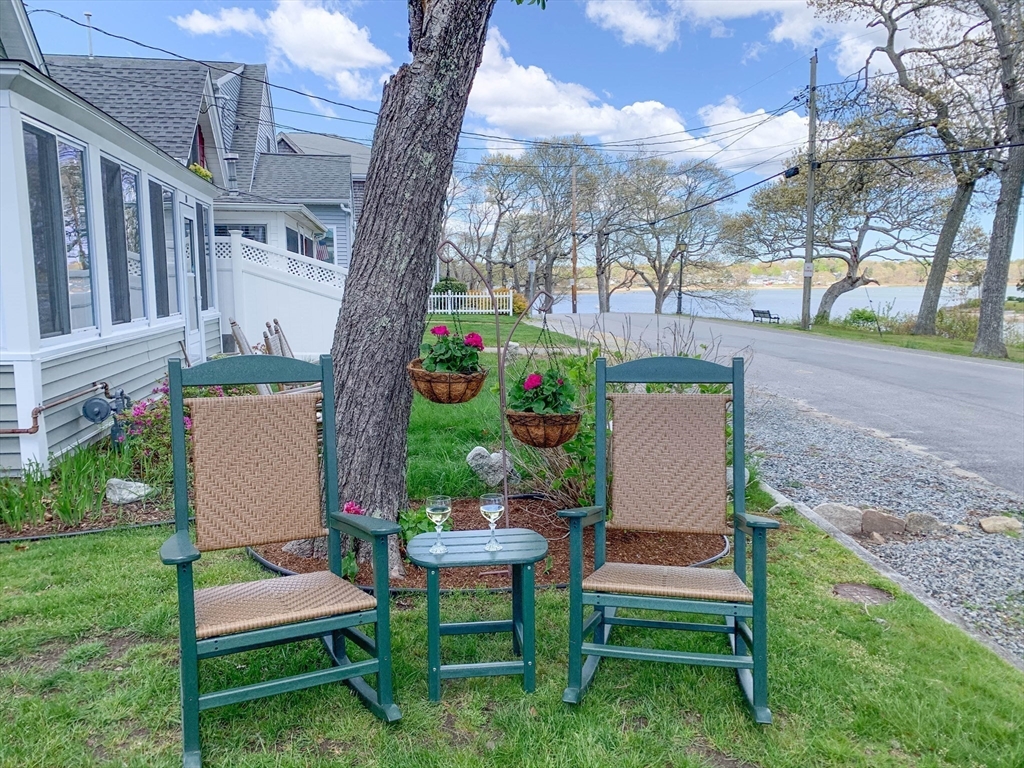 8 East Boulevard Wareham, MA 02558 - Photo 33 of 39 a view of a patio with a table chairs and a yard