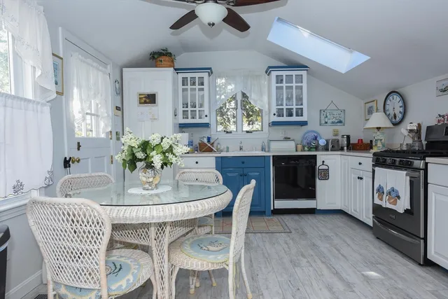 a dining room with furniture and window