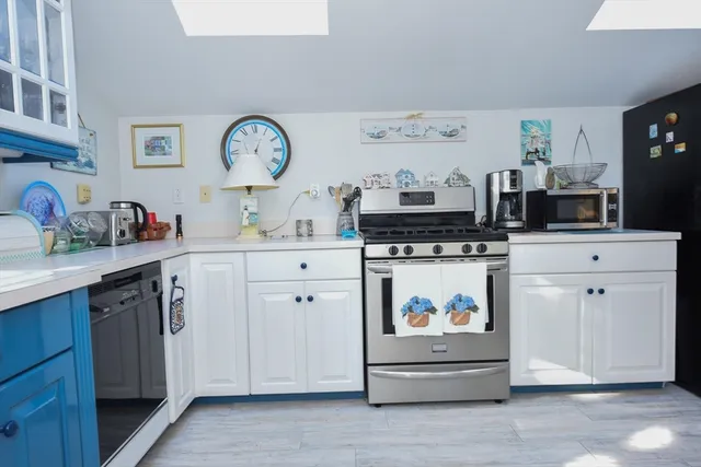 a kitchen with a stove and cabinets