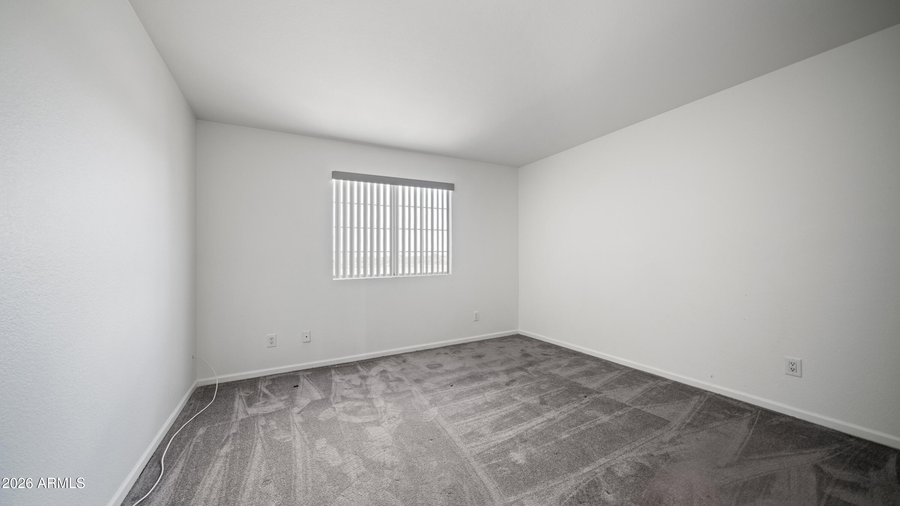 6620 West Redfield Road Glendale, AZ 85306 - Photo 26 of 33 an empty room with a window