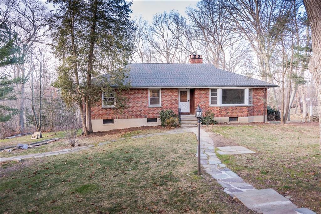 25 Ridgedale Road Easton, CT 06612 - Photo 1 of 1 a front view of a house with a yard and garage