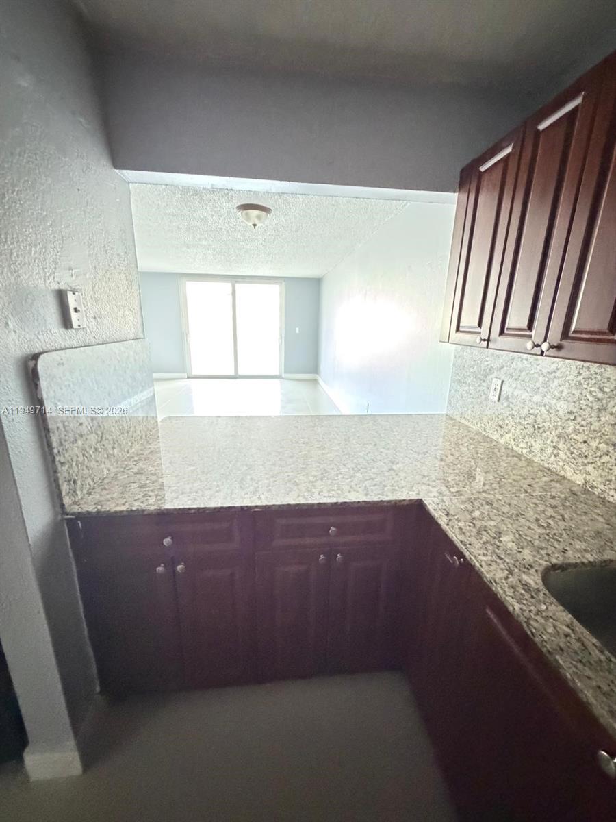 7010 Northwest 186th Street, Unit 5201 Hialeah, FL 33015 - Photo 15 of 29 a view of kitchen cabinets and window