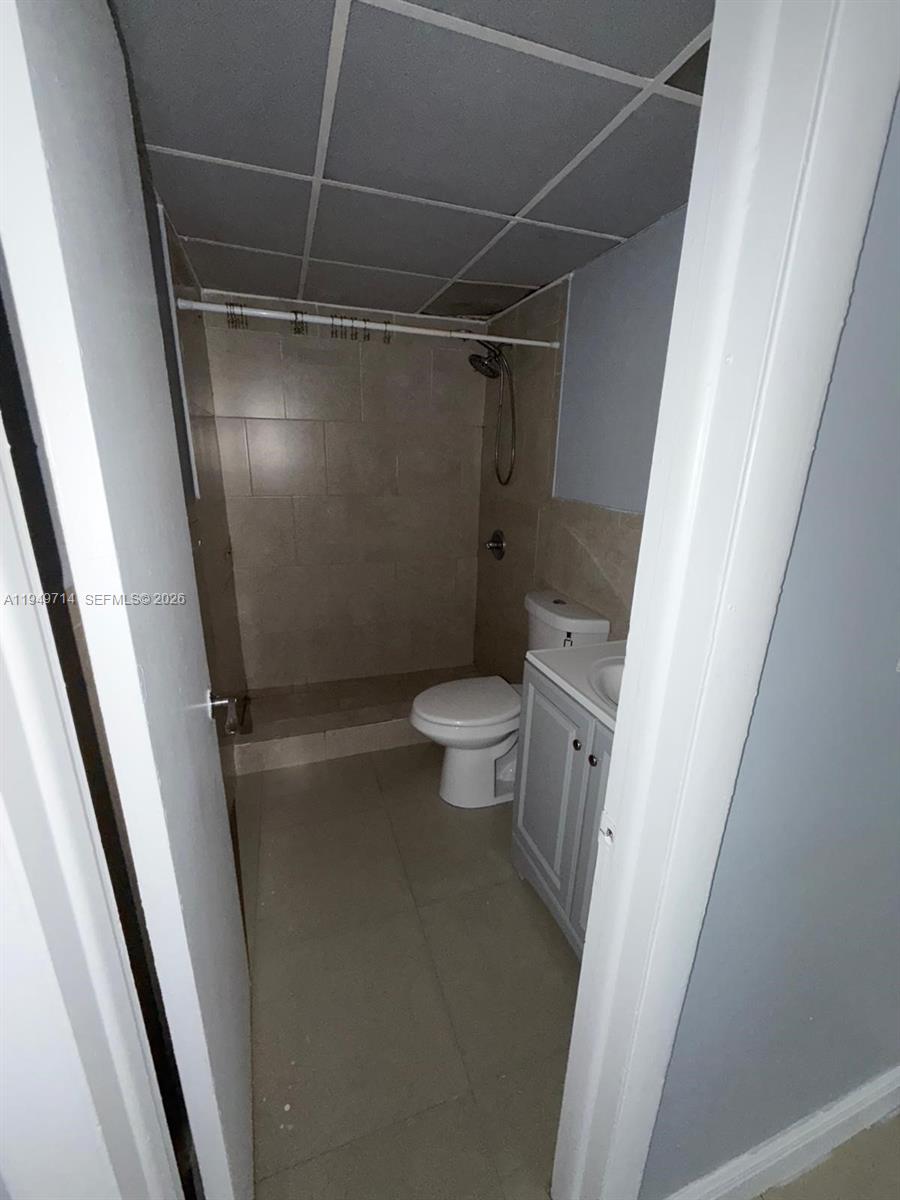 7010 Northwest 186th Street, Unit 5201 Hialeah, FL 33015 - Photo 20 of 29 a bathroom with a toilet and a shower