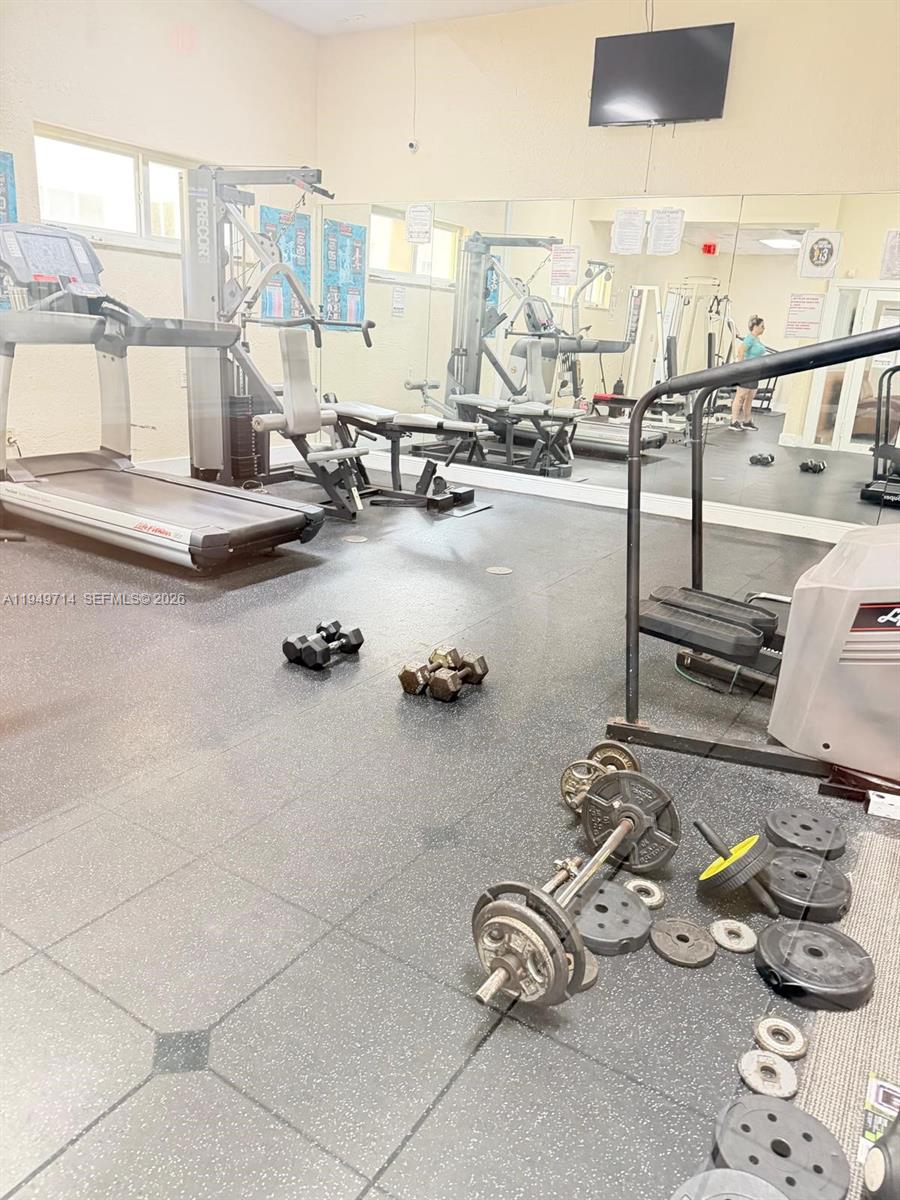 7010 Northwest 186th Street, Unit 5201 Hialeah, FL 33015 - Photo 26 of 29 a view of a room with gym equipment