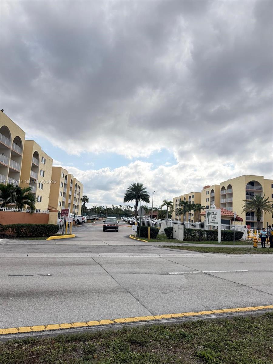 7010 Northwest 186th Street, Unit 5201 Hialeah, FL 33015 - Photo 4 of 29 a view of street with cars