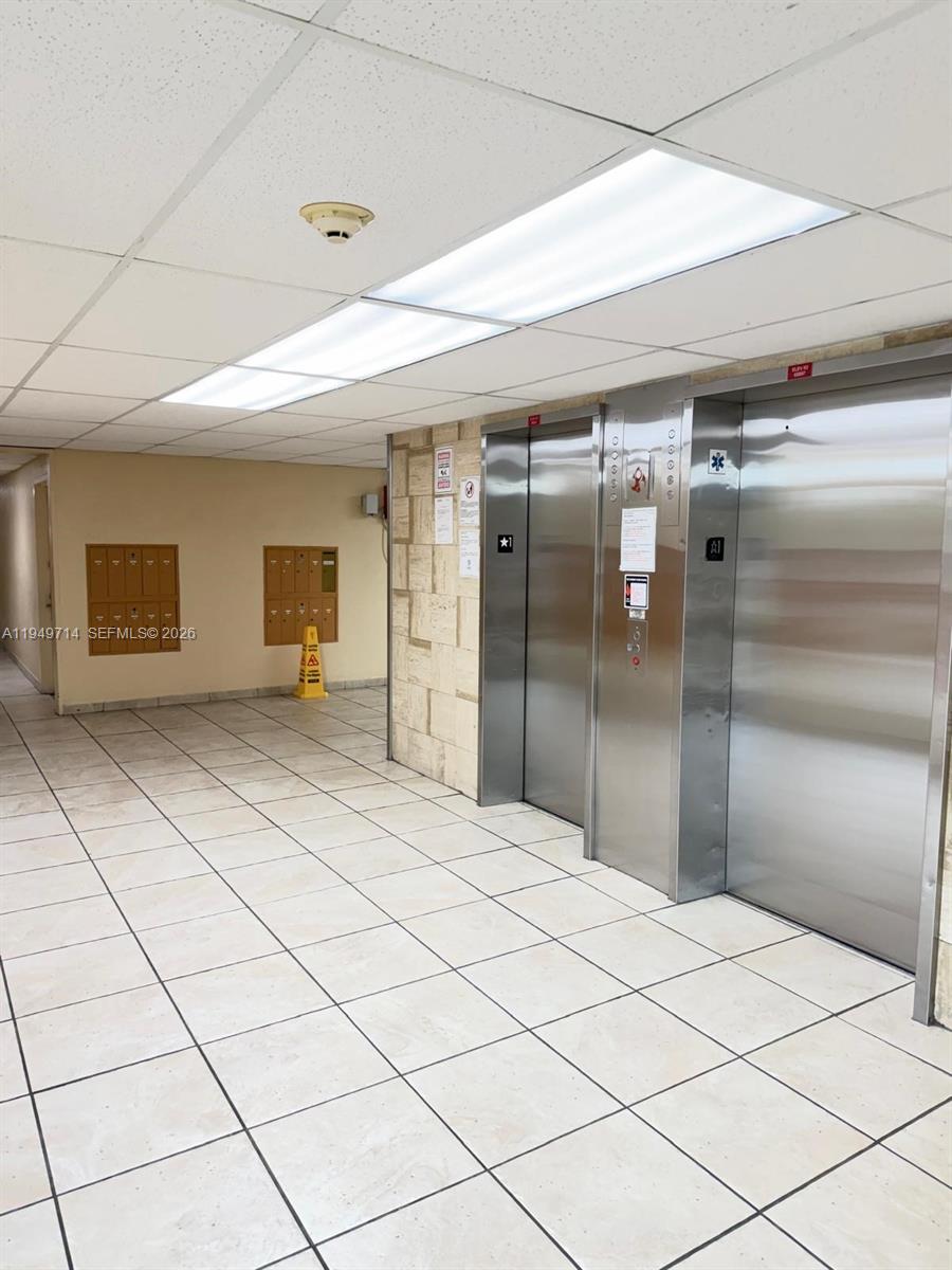 7010 Northwest 186th Street, Unit 5201 Hialeah, FL 33015 - Photo 7 of 29 a bathroom with a shower and a mirror