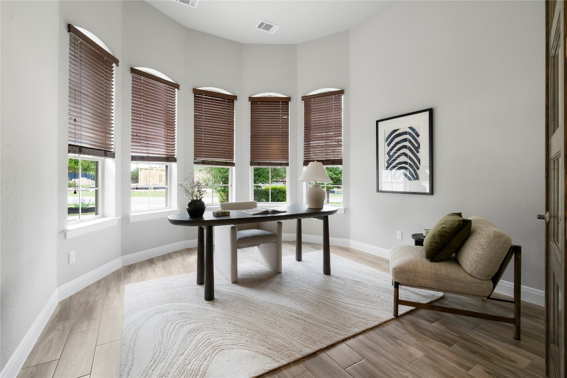 2033 Portobello Road Leander, TX 78641 - Photo 12 of 40 An office is positioned off the entry with panoramic windows.