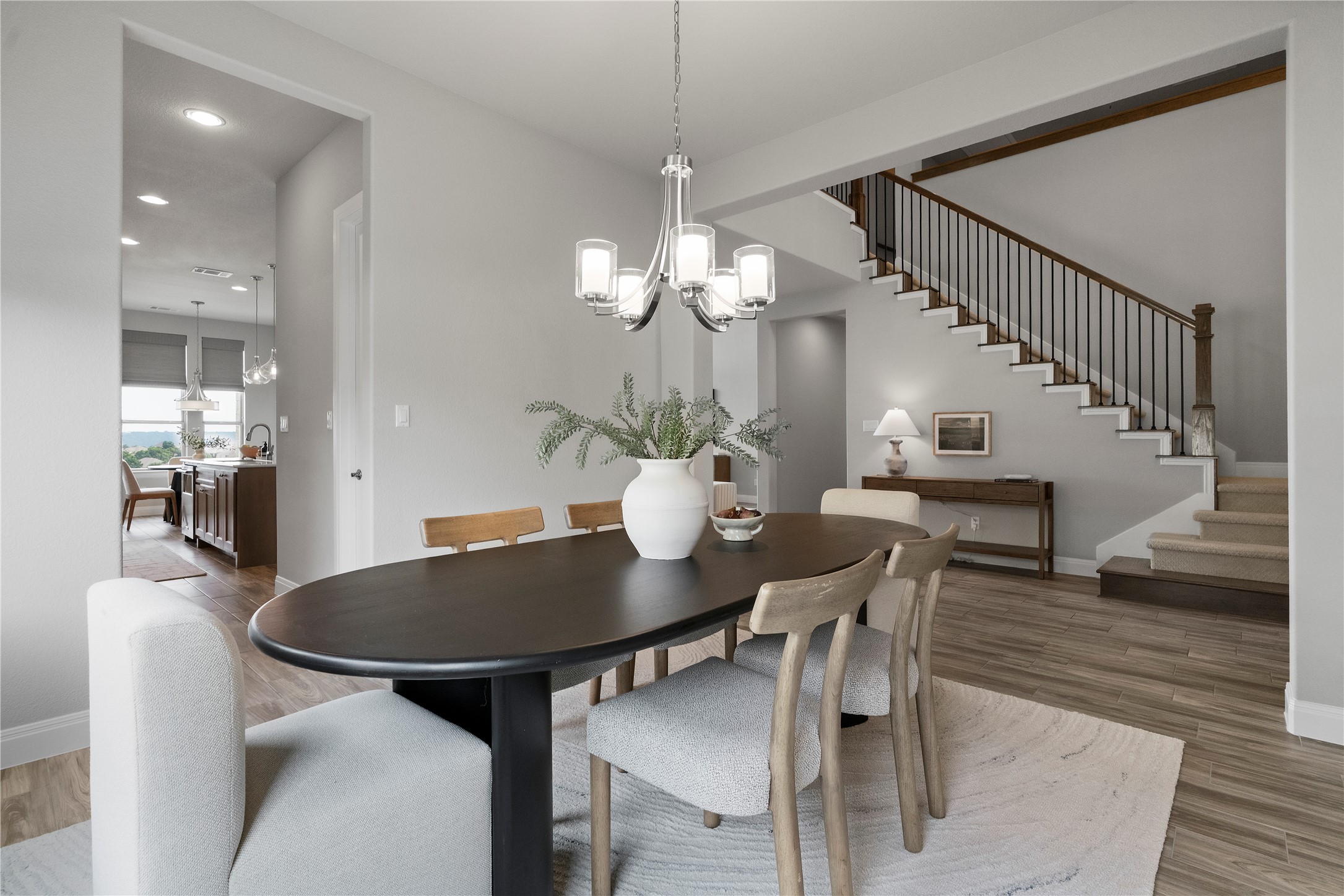 2033 Portobello Road Leander, TX 78641 - Photo 13 of 40 a view of a dining room with furniture and wooden floor