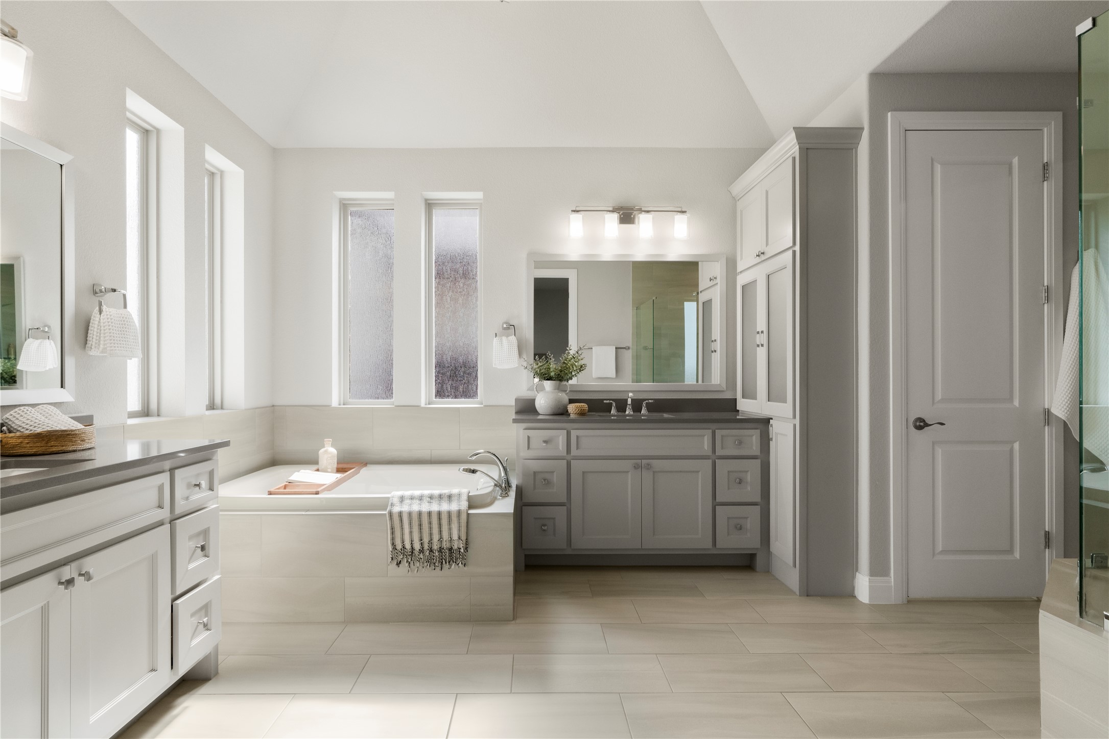 2033 Portobello Road Leander, TX 78641 - Photo 21 of 40 The opulent ensuite spa bathroom offers separate vanities and a soaking tub.