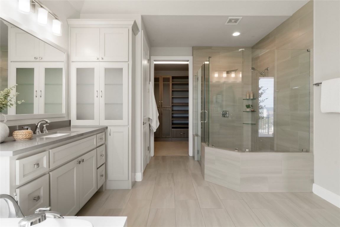 2033 Portobello Road Leander, TX 78641 - Photo 22 of 40 An oversized walk-in shower is equipped with dual showerheads.