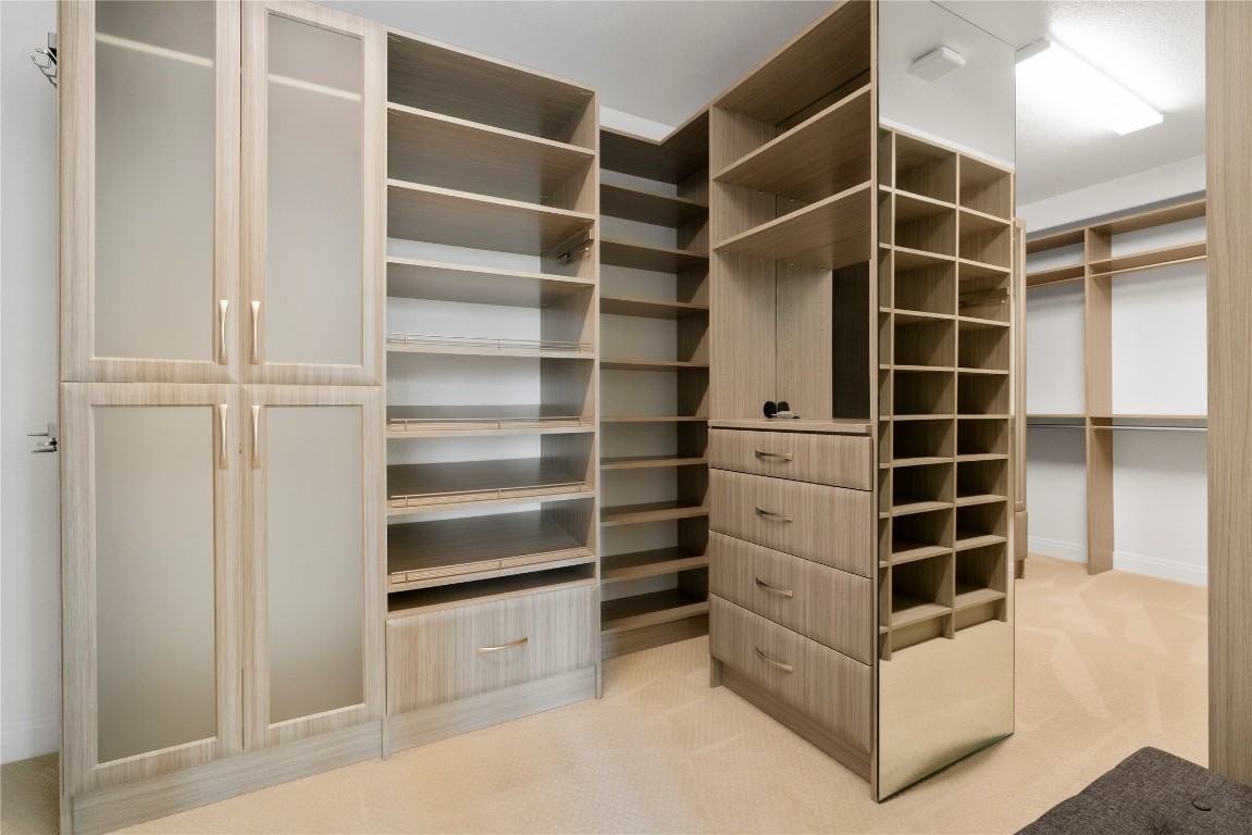 2033 Portobello Road Leander, TX 78641 - Photo 23 of 40 Your dream closet awaits with a custom, built-in storage system.