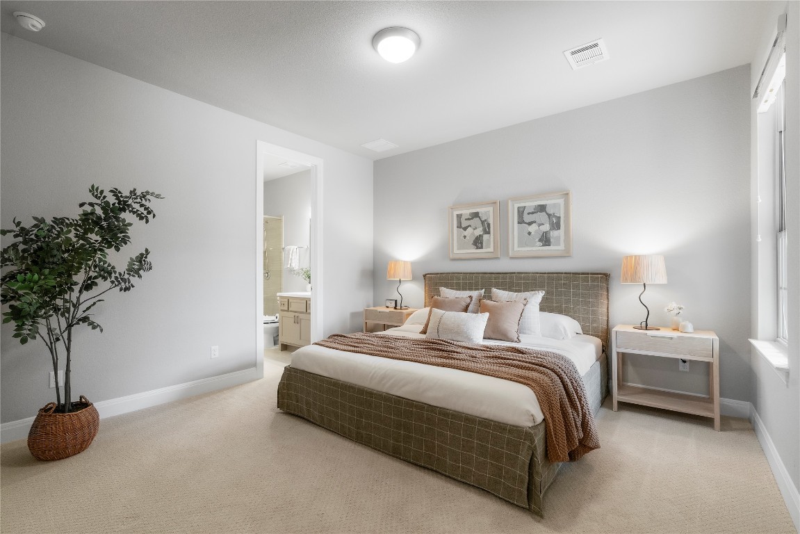 2033 Portobello Road Leander, TX 78641 - Photo 24 of 40 The main level hosts one guest bedroom with an ensuite bath.