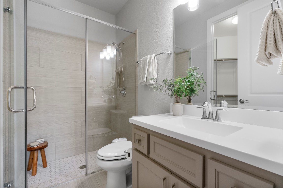 2033 Portobello Road Leander, TX 78641 - Photo 25 of 40 The ensuite features a walk-in shower.