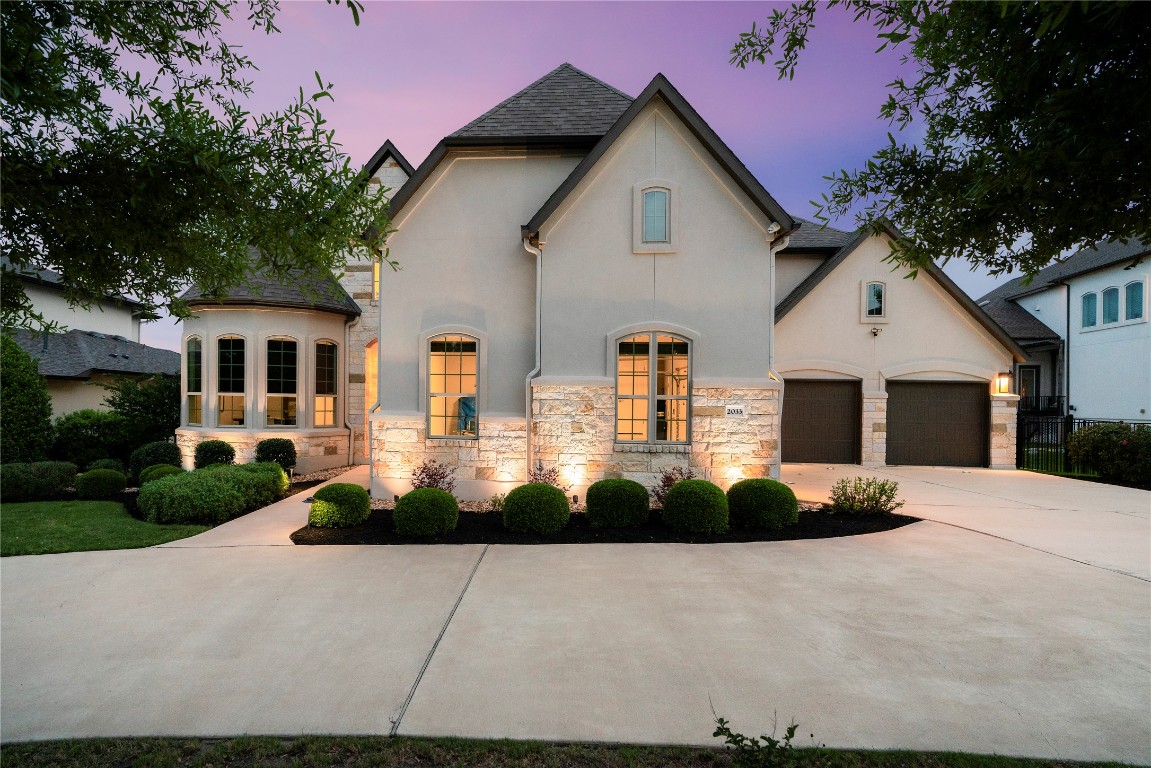 2033 Portobello Road Leander, TX 78641 - Photo 10 of 40 Impressive architecture, detailed landscaping, lighting, and a circular drive are sure to impress as soon as you arrive.