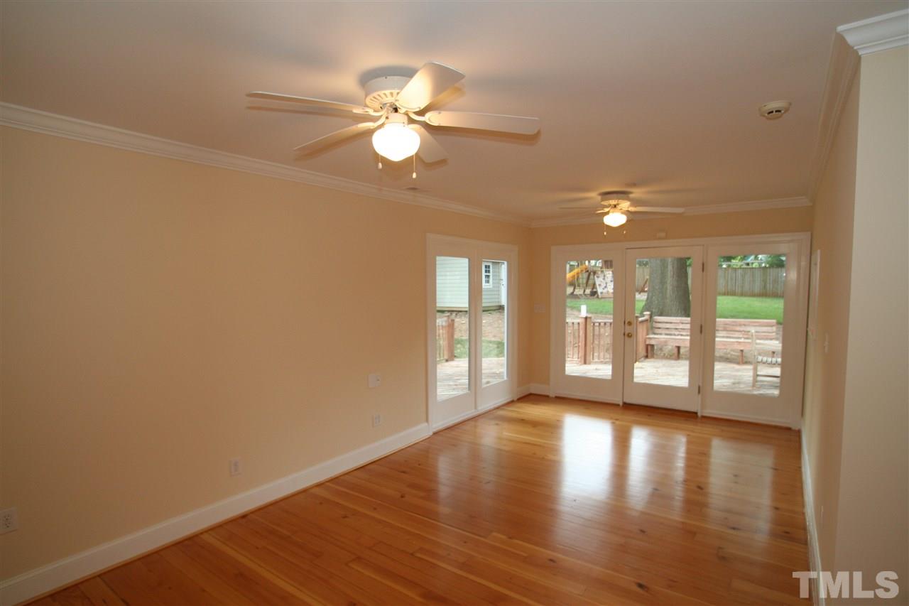 3021 Rothgeb Drive Raleigh, NC 27609 - Photo 7 of 22 Family room with refinished hardwood floors and new paint...
