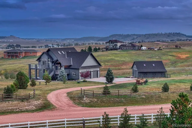 an aerial view of a house with a ocean view
