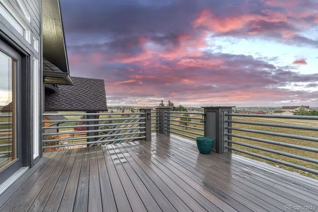 a view of a porch with wooden floor