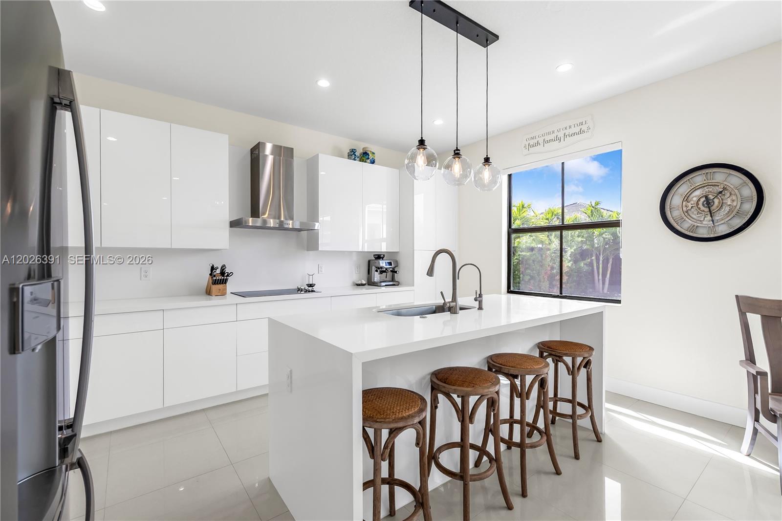 14606 Southwest 22nd Terrace Miami, FL 33175 - Photo 18 of 43 a kitchen with stainless steel appliances granite countertop a table chairs sink and cabinets