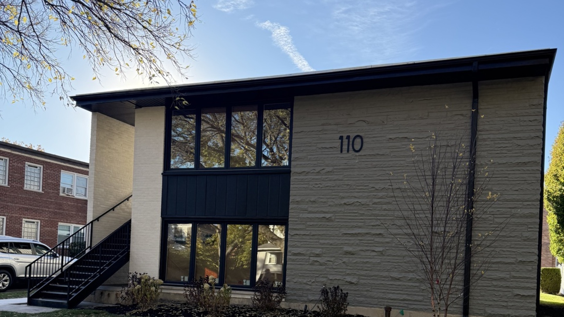 110 North Willow Road, Unit 3 Elmhurst, IL 60126 - Photo 1 of 3 a front view of a house with glass windows