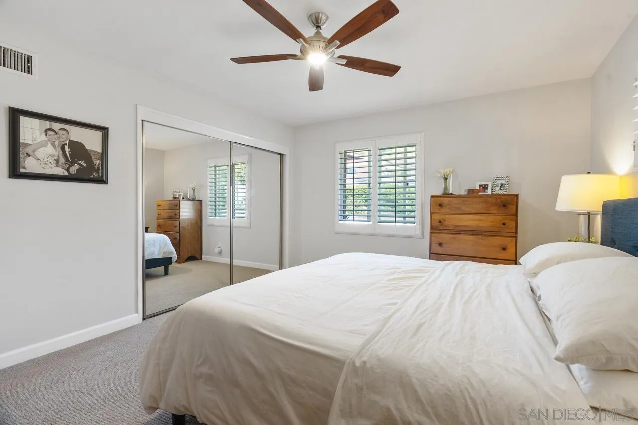 6365 Lambda Drive San Diego, CA 92120 - Photo 14 of 31 a bedroom with a bed and dresser with chair